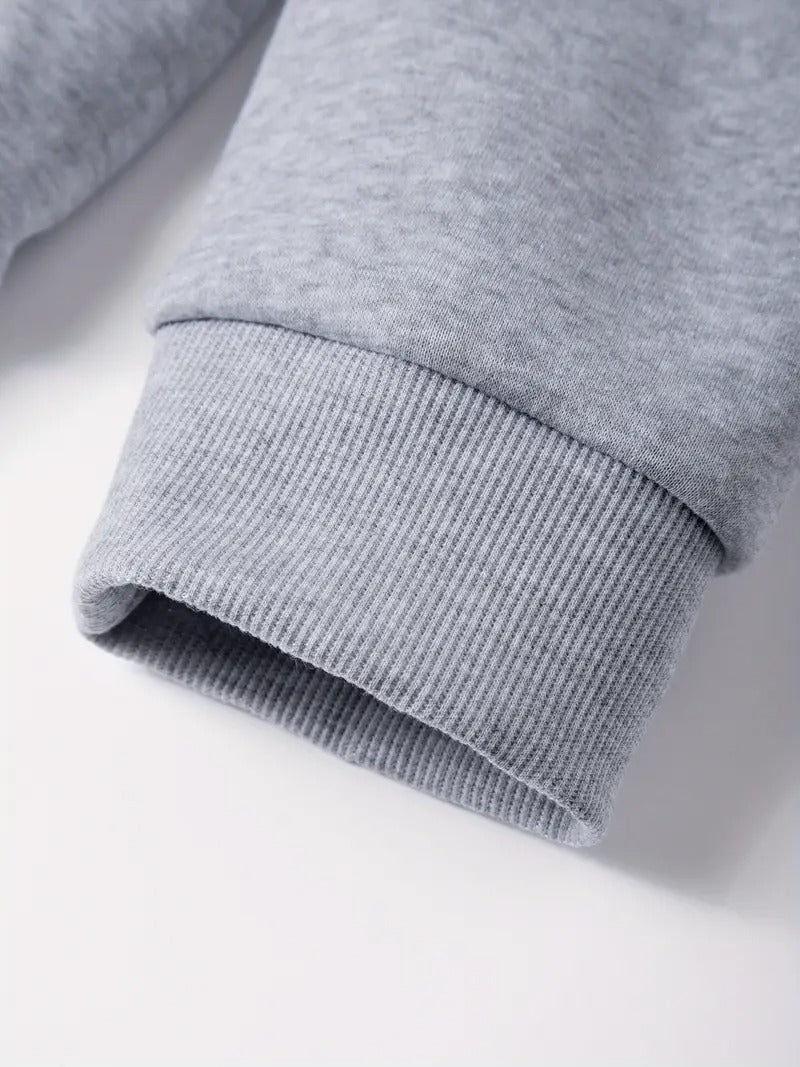 Close-up of a gray sweatshirt sleeve