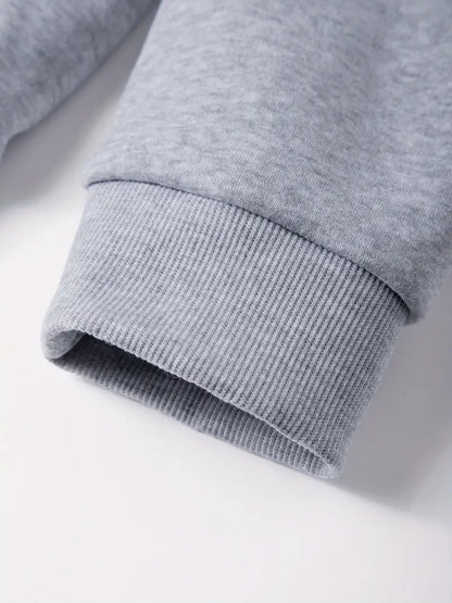 Close-up of a gray sweatshirt sleeve